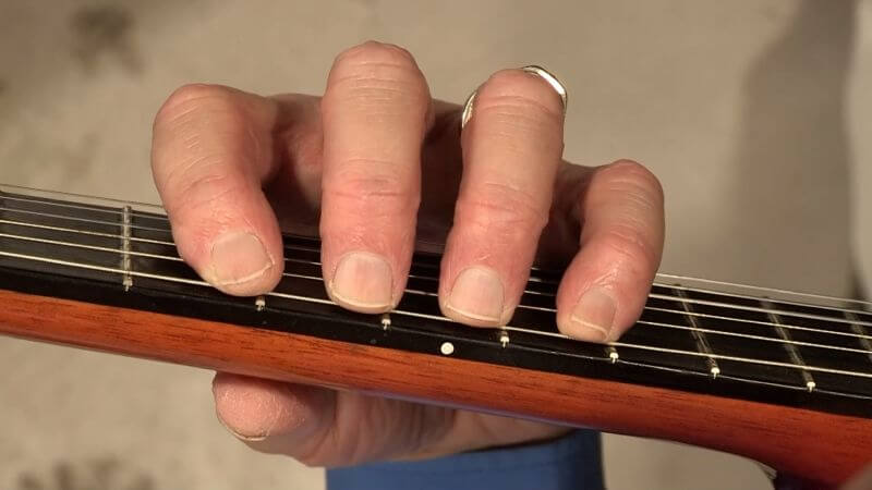 Set the fingers lightly on the 6th string in 5th position